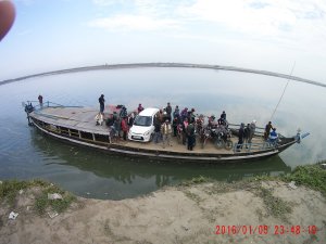People sailing ferry at dunaguri ghat