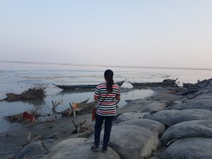 Ah girl looking boat and Brahmaputra river Majuli