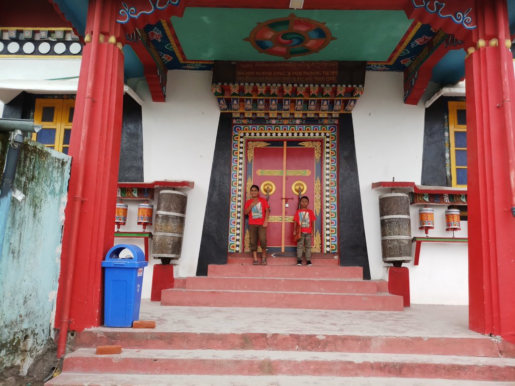 Kids standing at the entrance of Durpin Monastery in Kalimpong